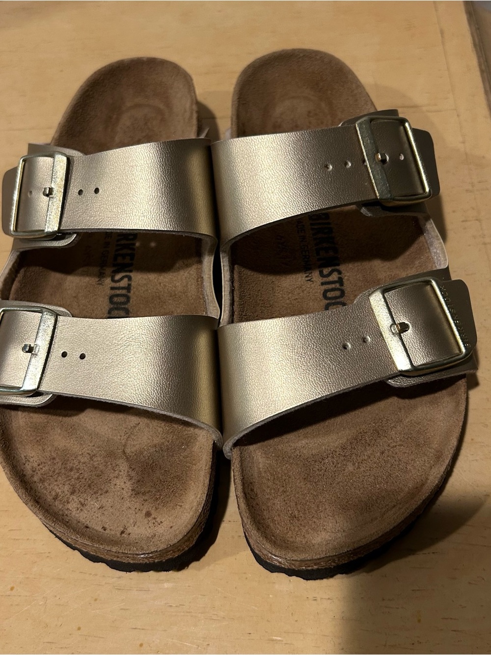 Birkenstock Arizona Birko-flor gold two strap sandals in size 39 eu or us 8